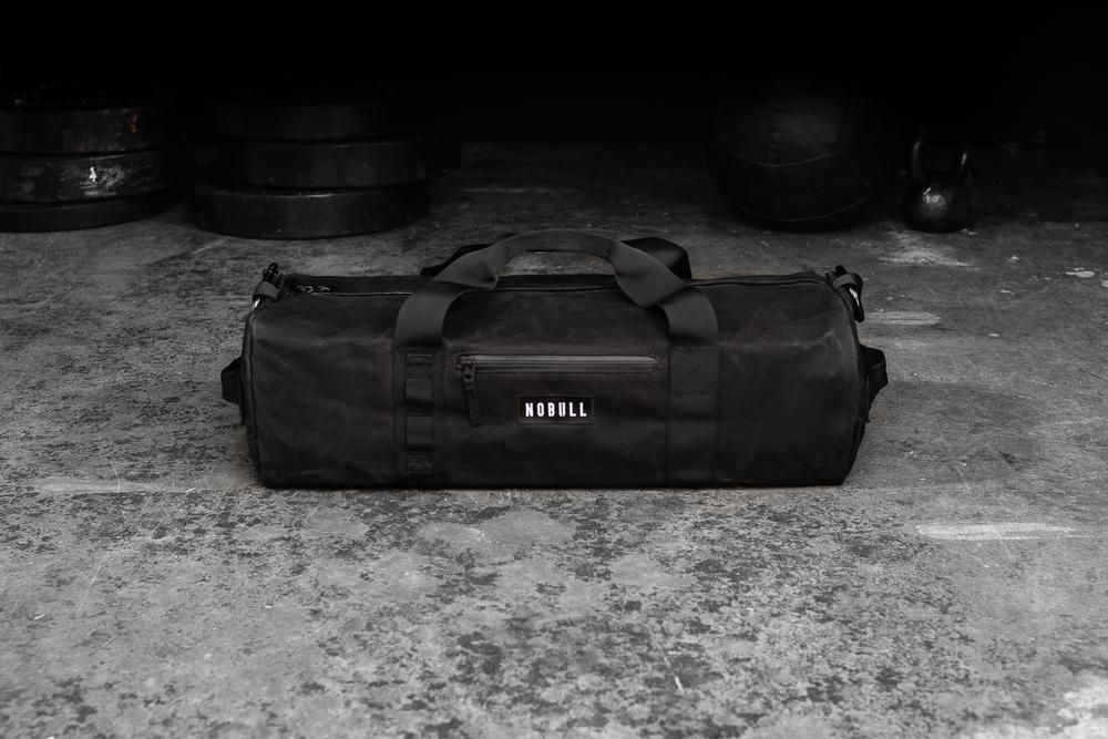 NOBULL Ruksaci - Nobull Waxed Canvas Traditional Duffle Crne (093582-ZNF)